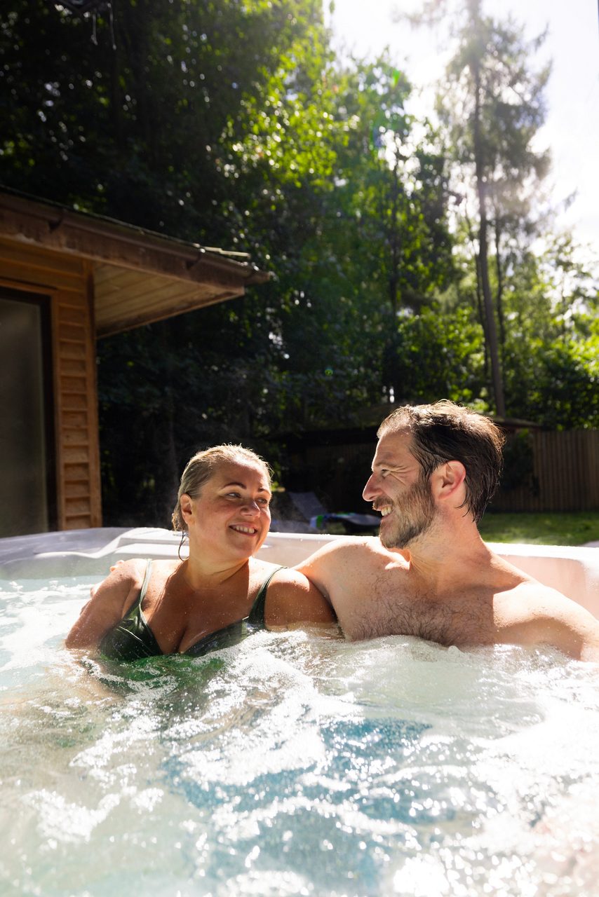 Adults sat in a hot tub at Center Parcs