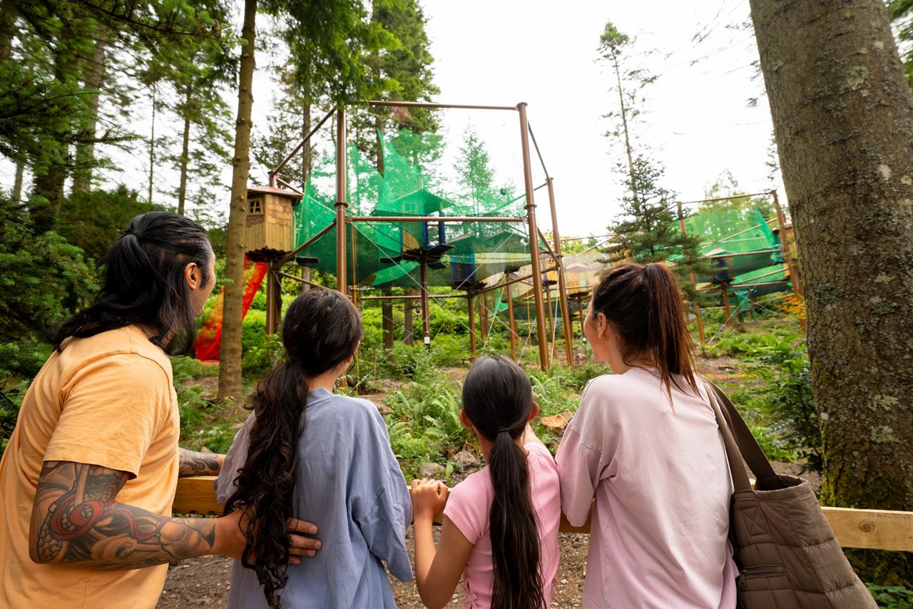 family looking out at adventure nets activity