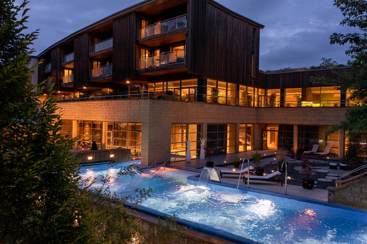 Flowing Outdoor Pool surrounded by luxury spa accommodation. 
