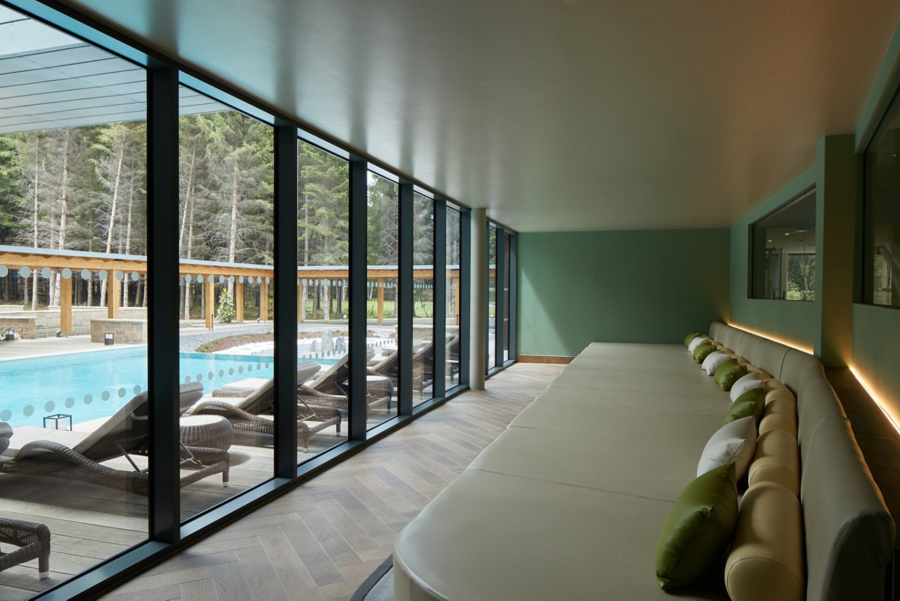 Forest View relax area looking out to the outdoor pool.