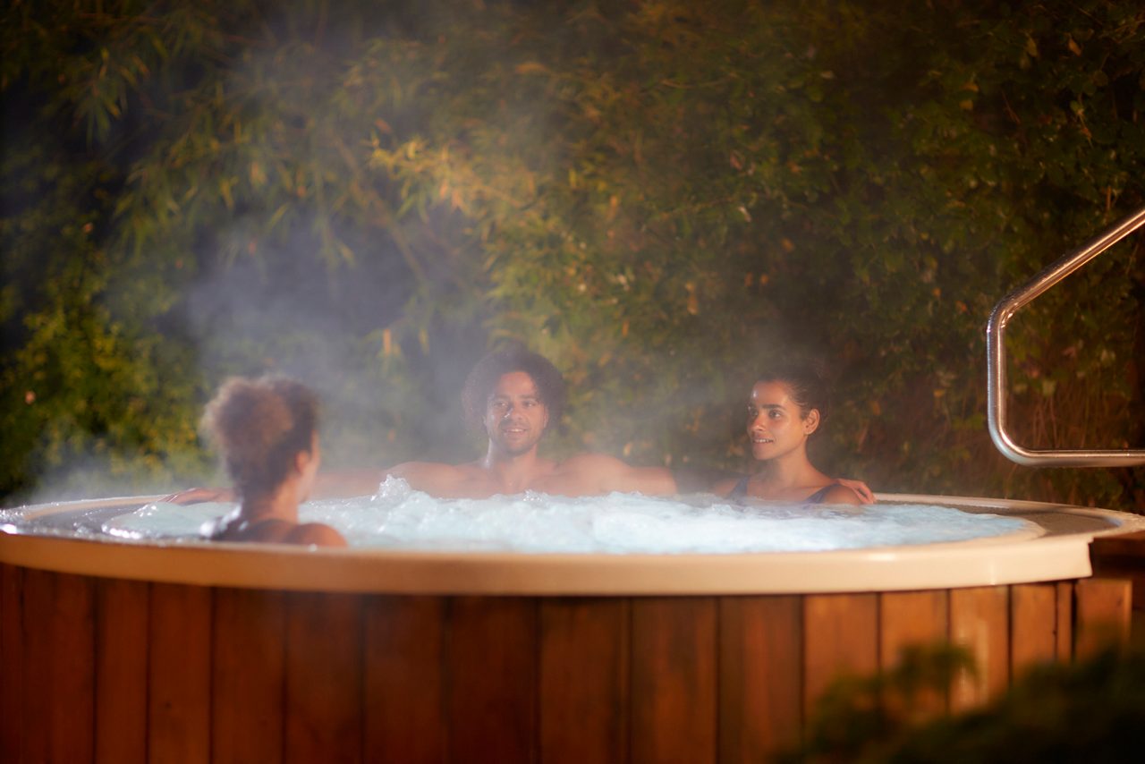 two people in robes enjoying a hot chocolate at the aqaua sana forest spa