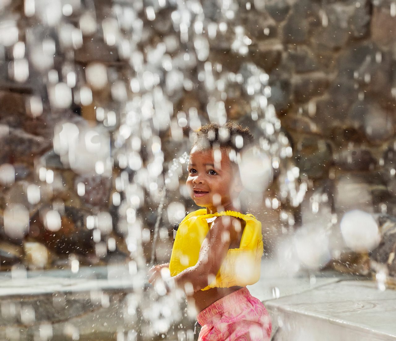 A little girl splashing in the Subtropical Swimming Paradise.