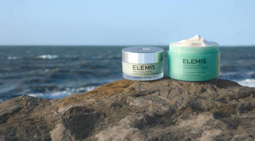 elemis products on a rock with the sea in the background