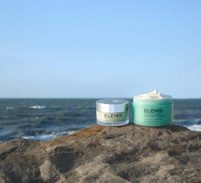 ELEMIS products lined up with a background of the sea.