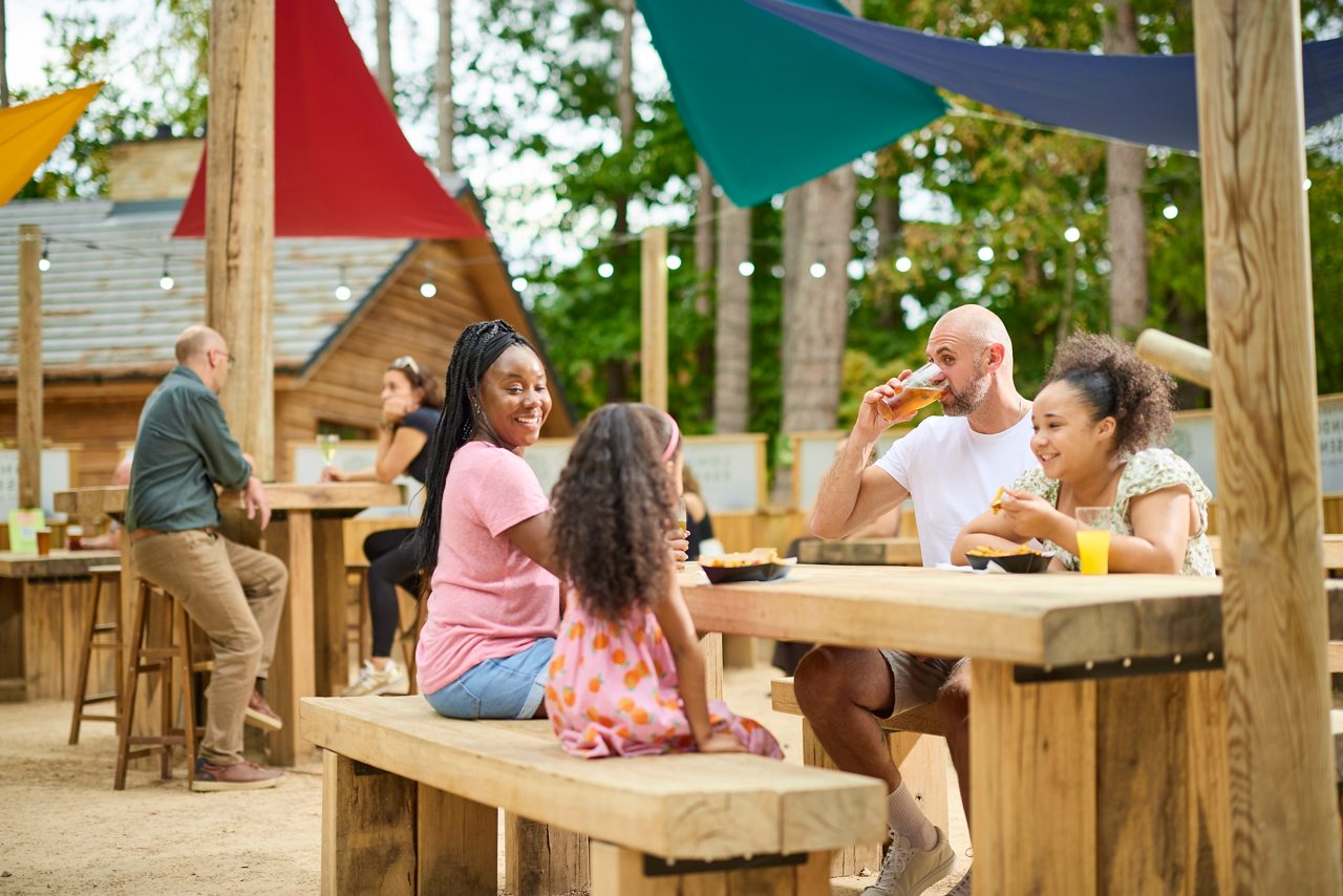 family sitting around table having drinks