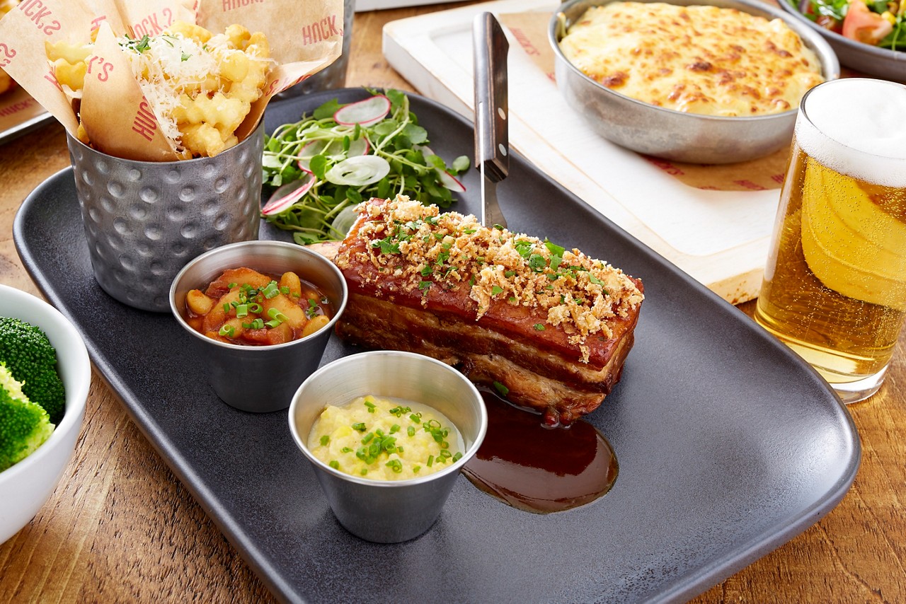 Slow cooked pork belly served with fries, dips and a salad.