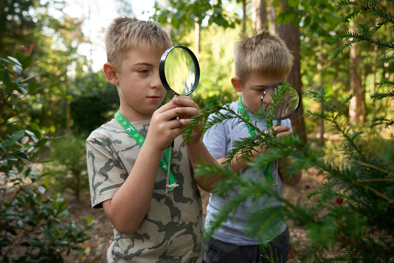 child dressed as scientist making experiments