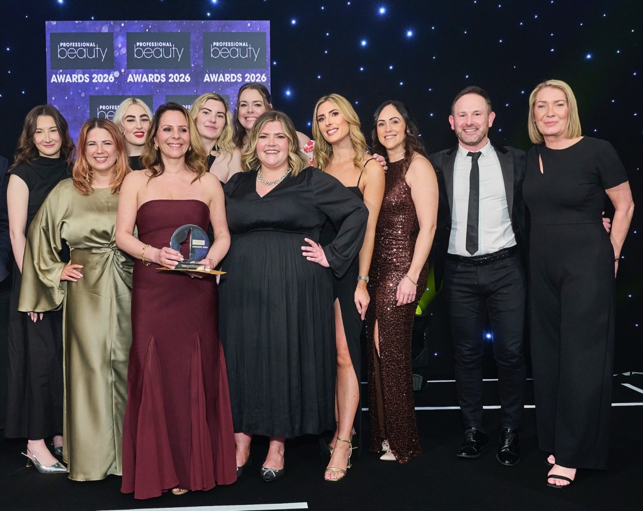 Group standing accepting an award.