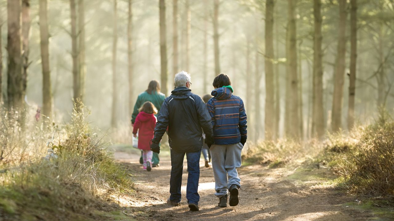 family walking through forest
