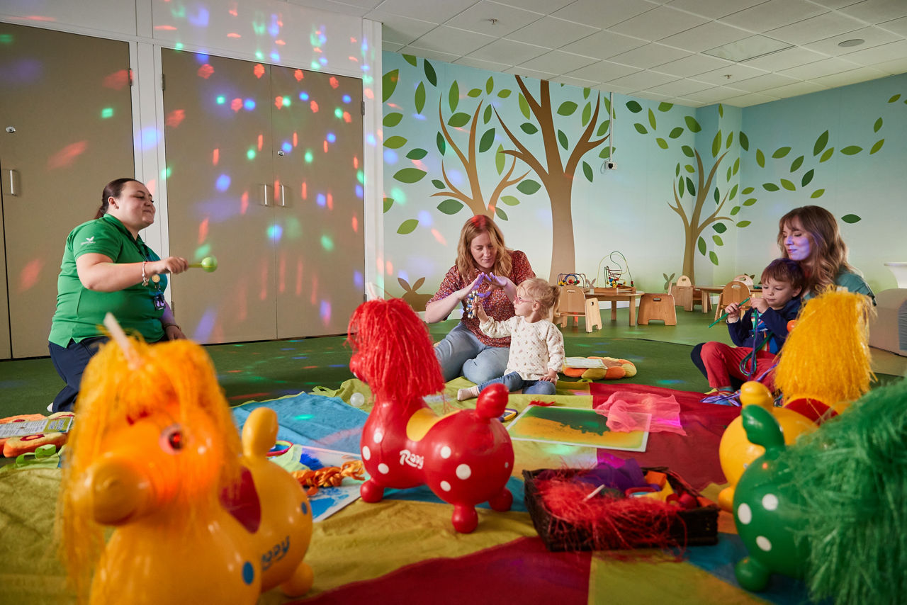 A toddler in the sensory play area. 