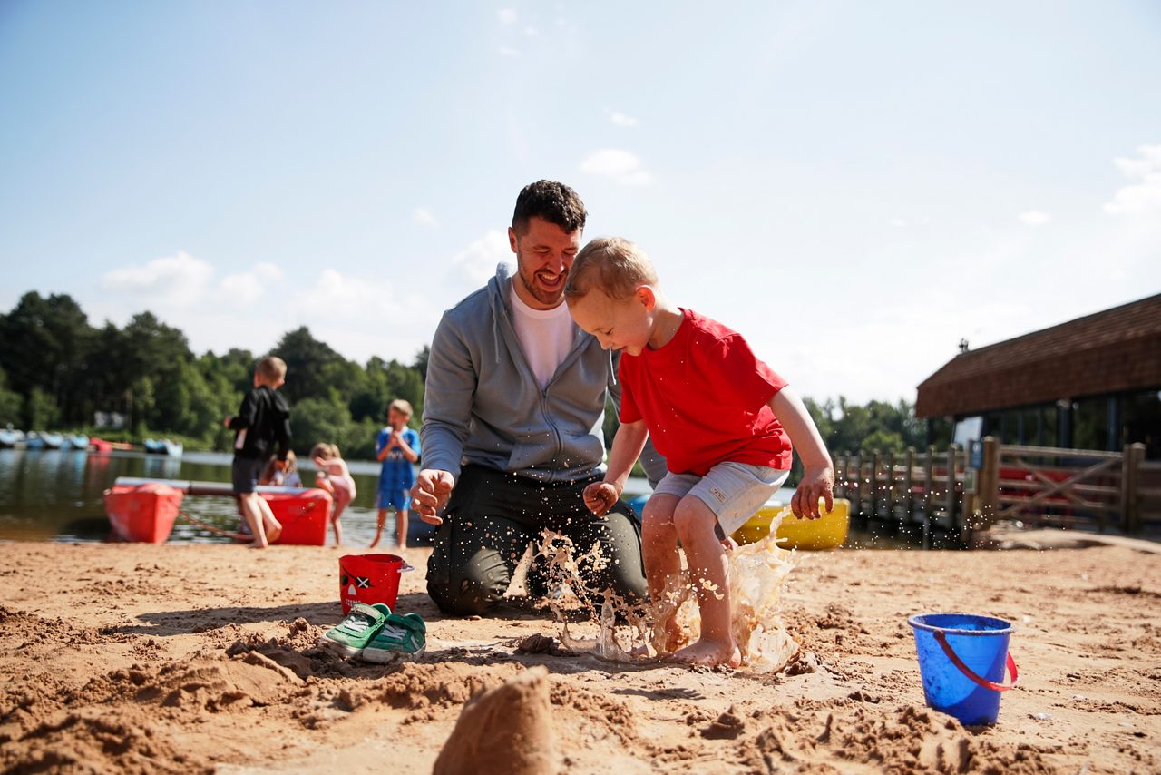 family playing on the beach