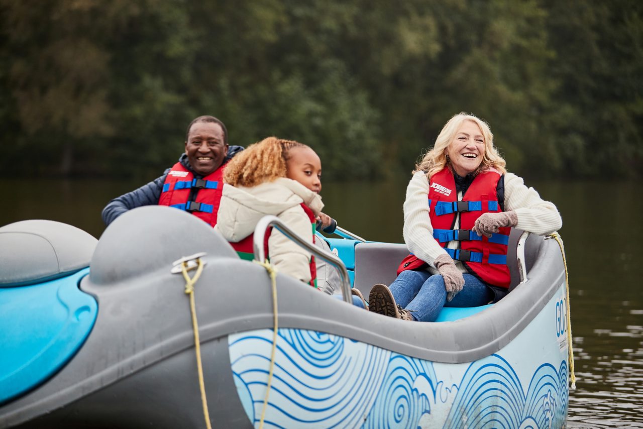 Family building a den in the forest.