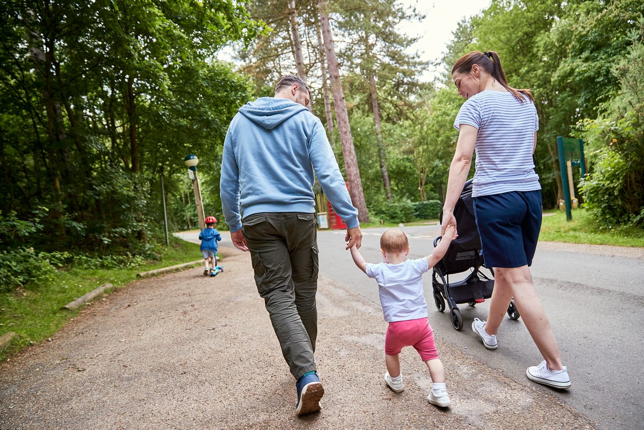 Family walking through the forest. 