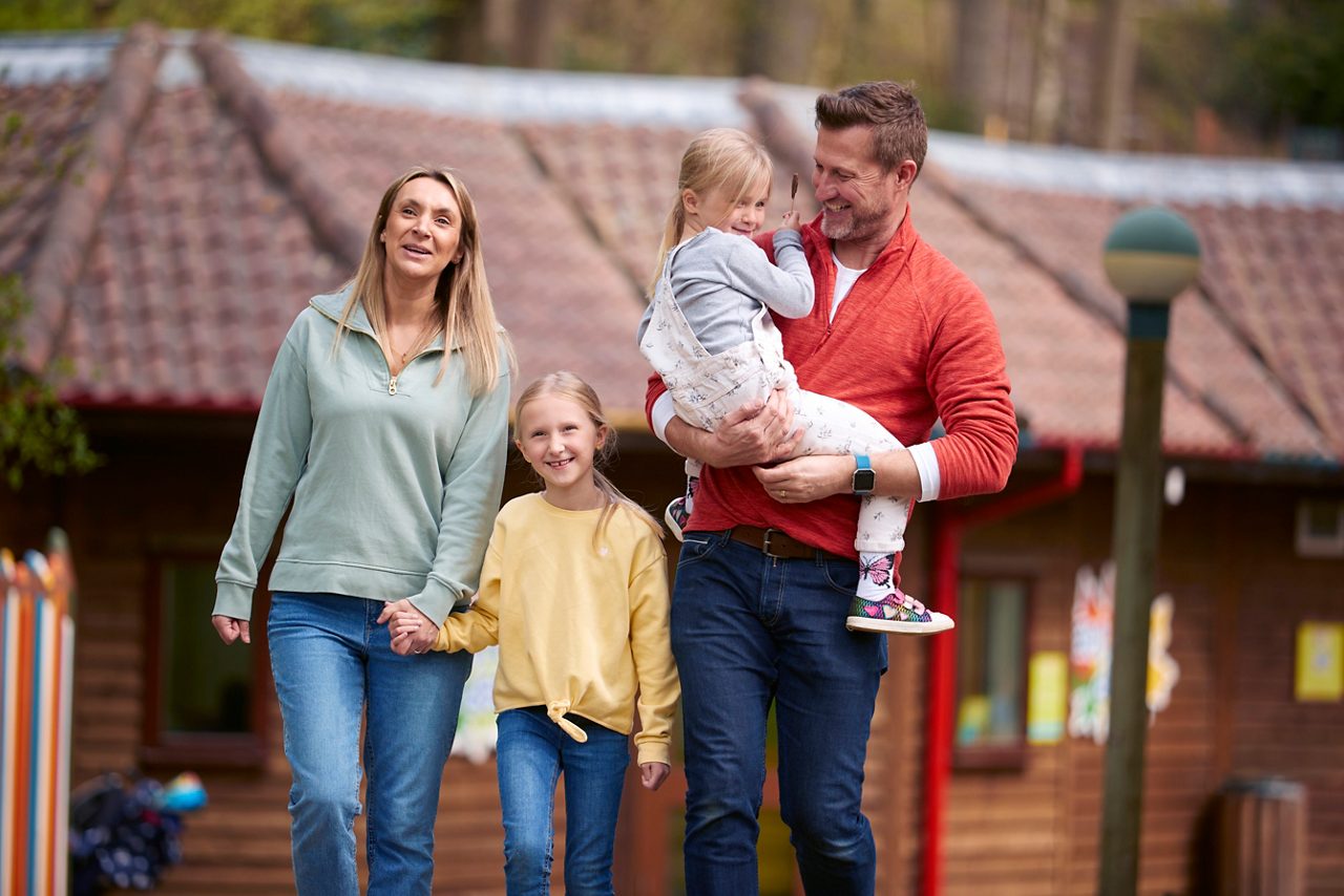 A family walking through the village.