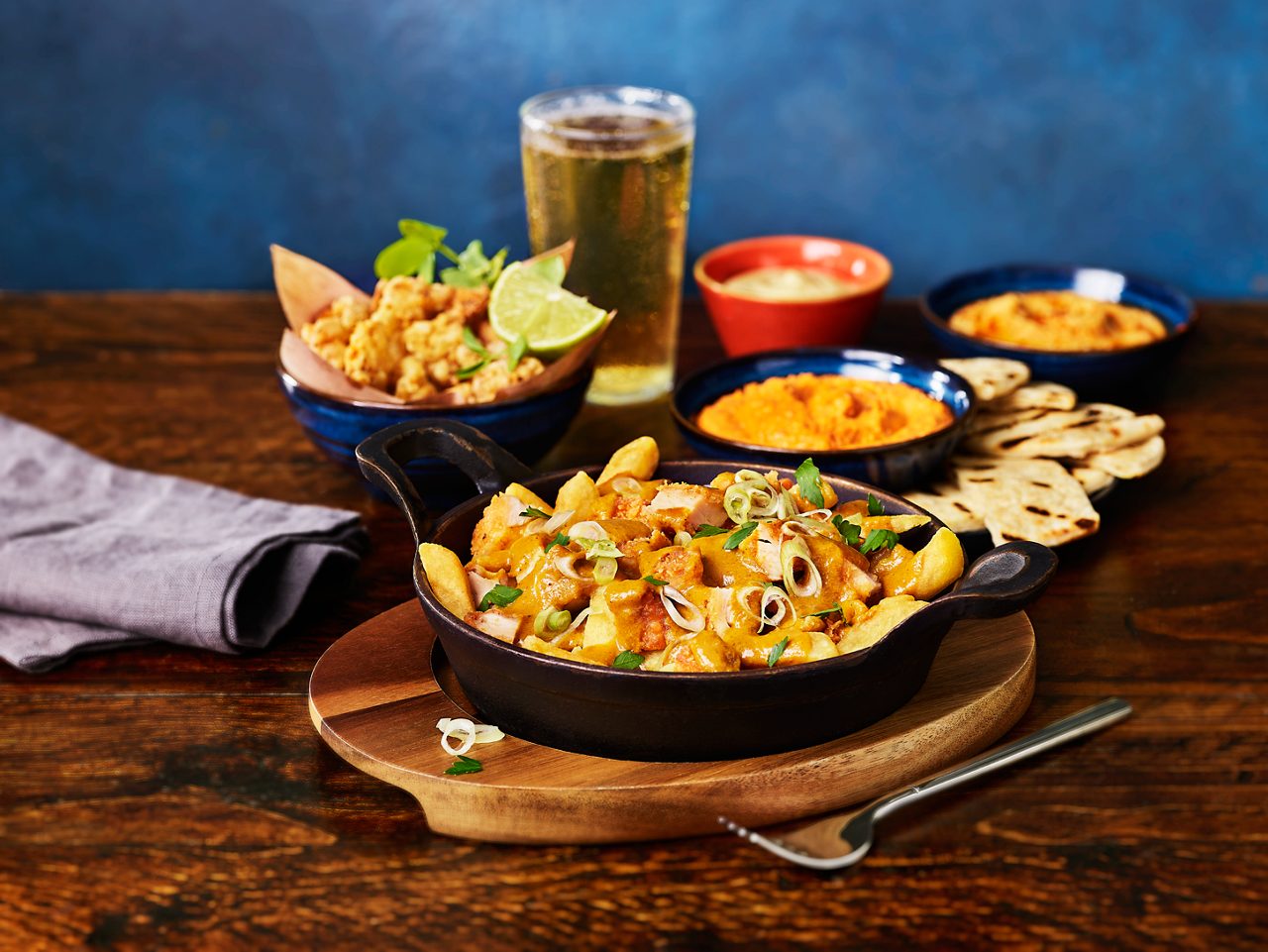 array of different food dishes from nachos to salads 
