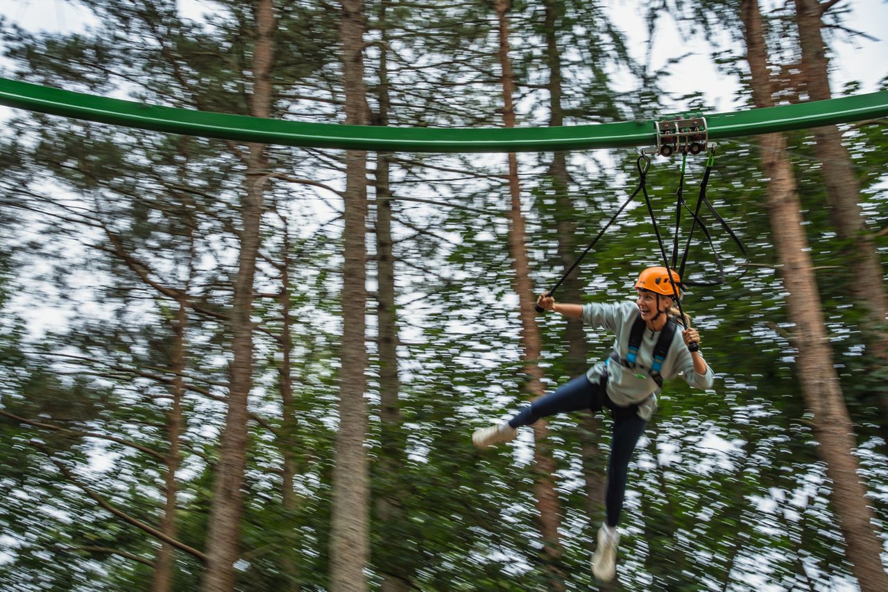 Two children jumping on the Adventure Nets activity.