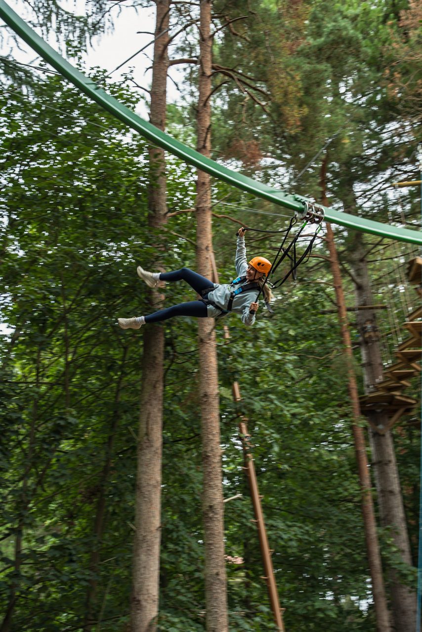 girl on treetop glider