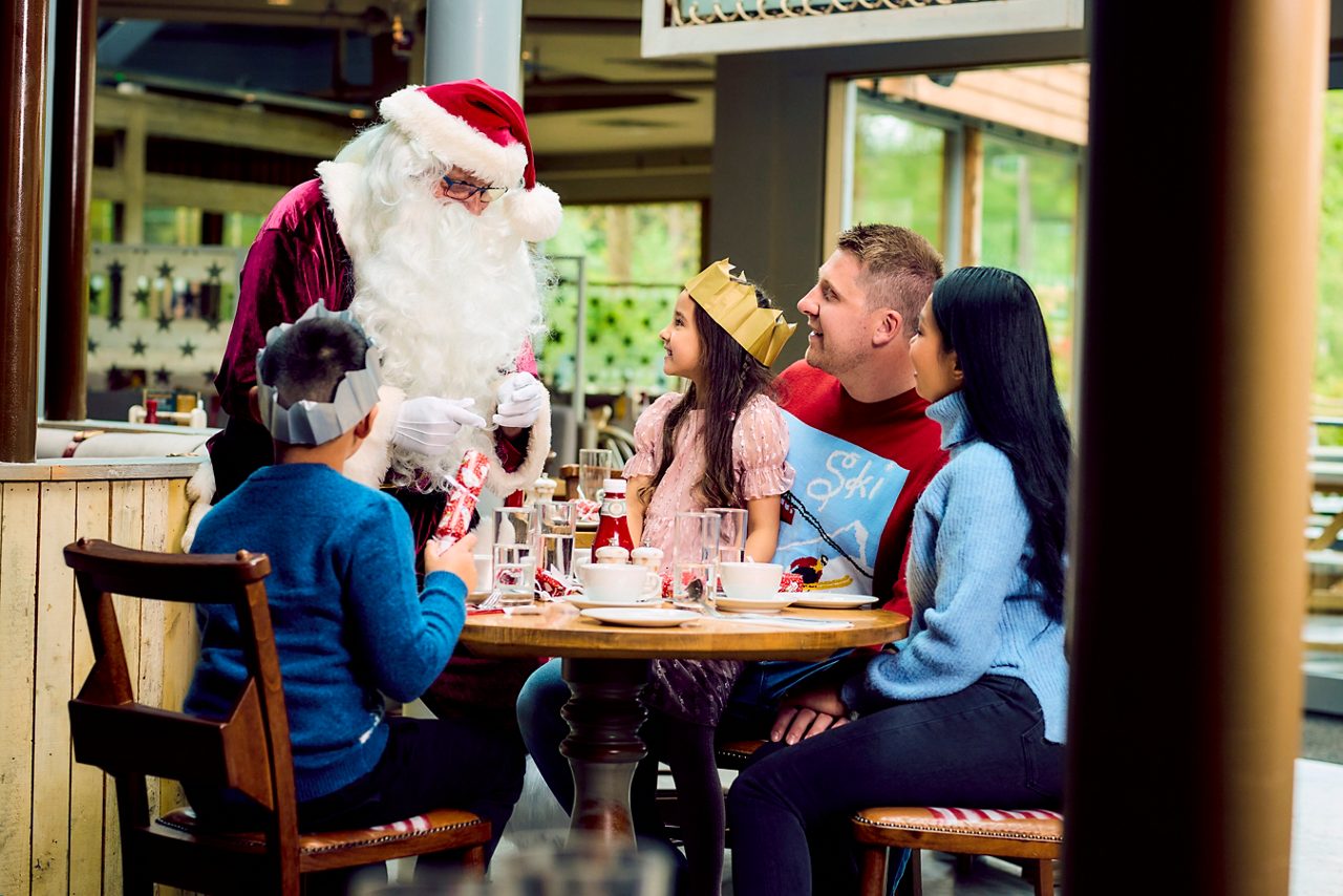 Family enjoying dinner with a special visit from Santa.