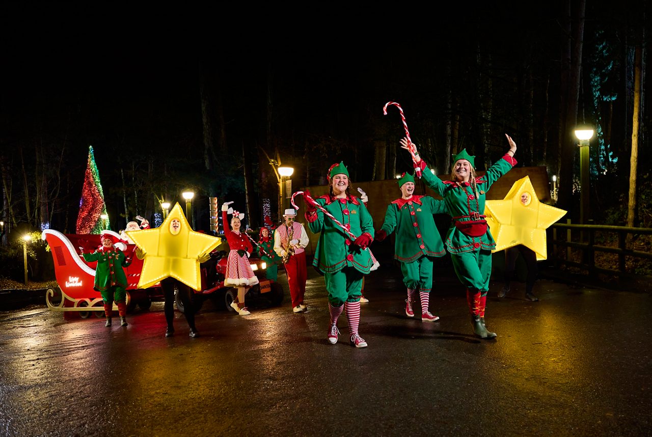 santa and elves travelling around village