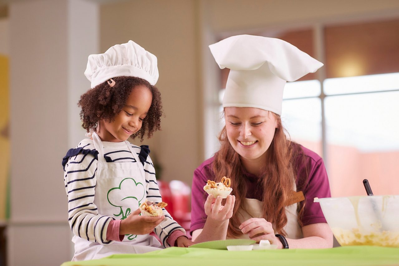 child dressed as scientist making experiments