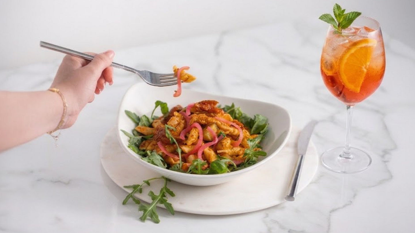 Pasta dish served with a mocktail