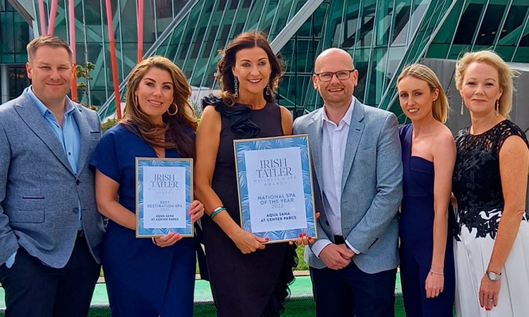 Group of Aqua Sana staff members holding a Tatler award