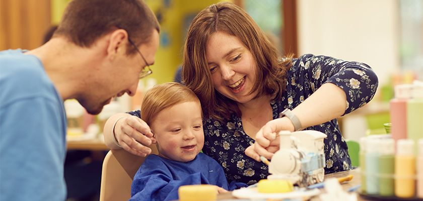 Family enjoy pottery painting