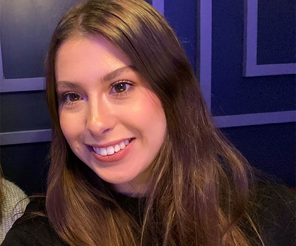 Alex Newborough smiling at camera