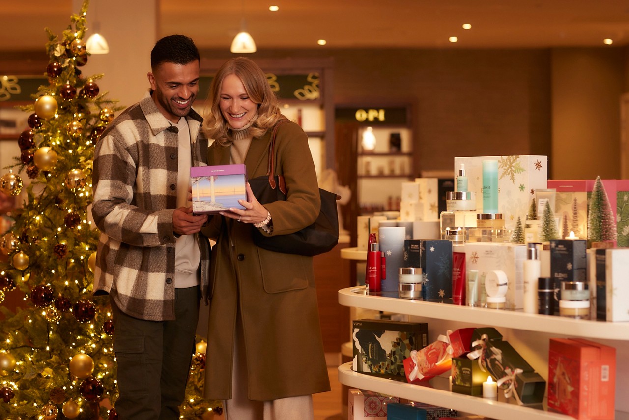 Couple shopping for presents in the Forest Spa Boutique.
