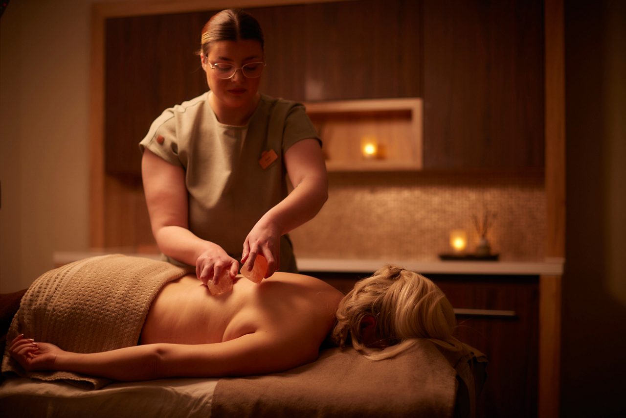 A lady recieving a back massage. 
