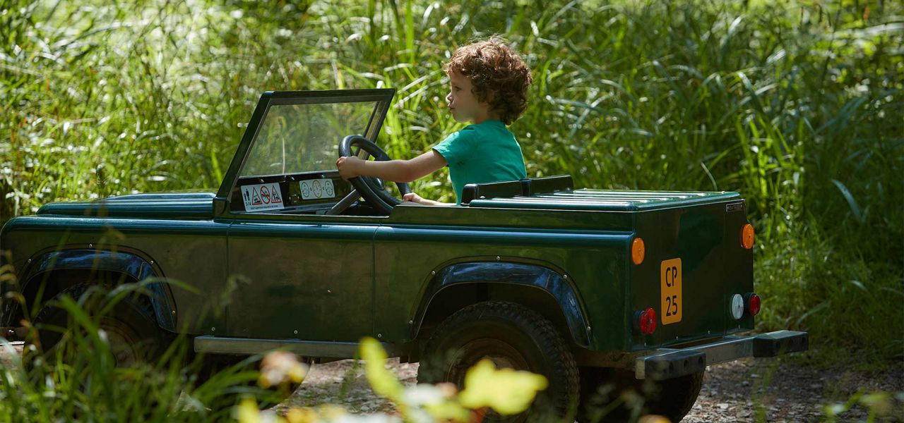 Child in mini explorers Jeep