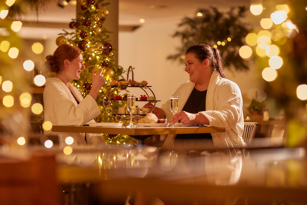 Two women sharing a platter in the Vitale Cafe Bar.
