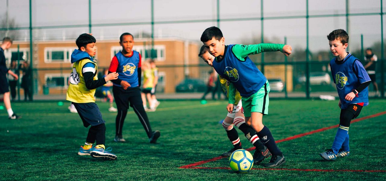 A group of young boys playing football