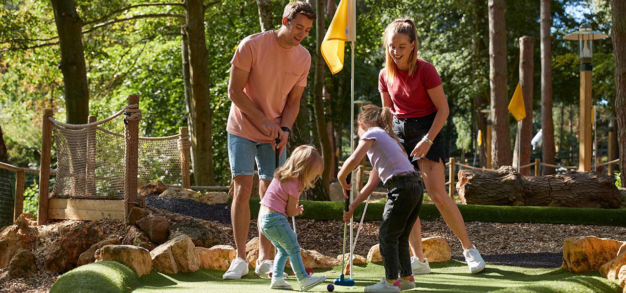 mother and son playing badminton at woburn forest