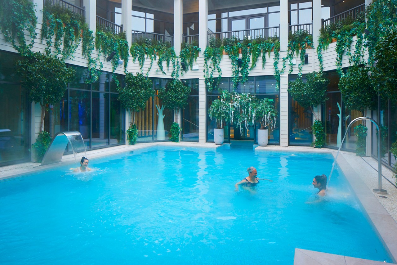 people in the outdoor pool