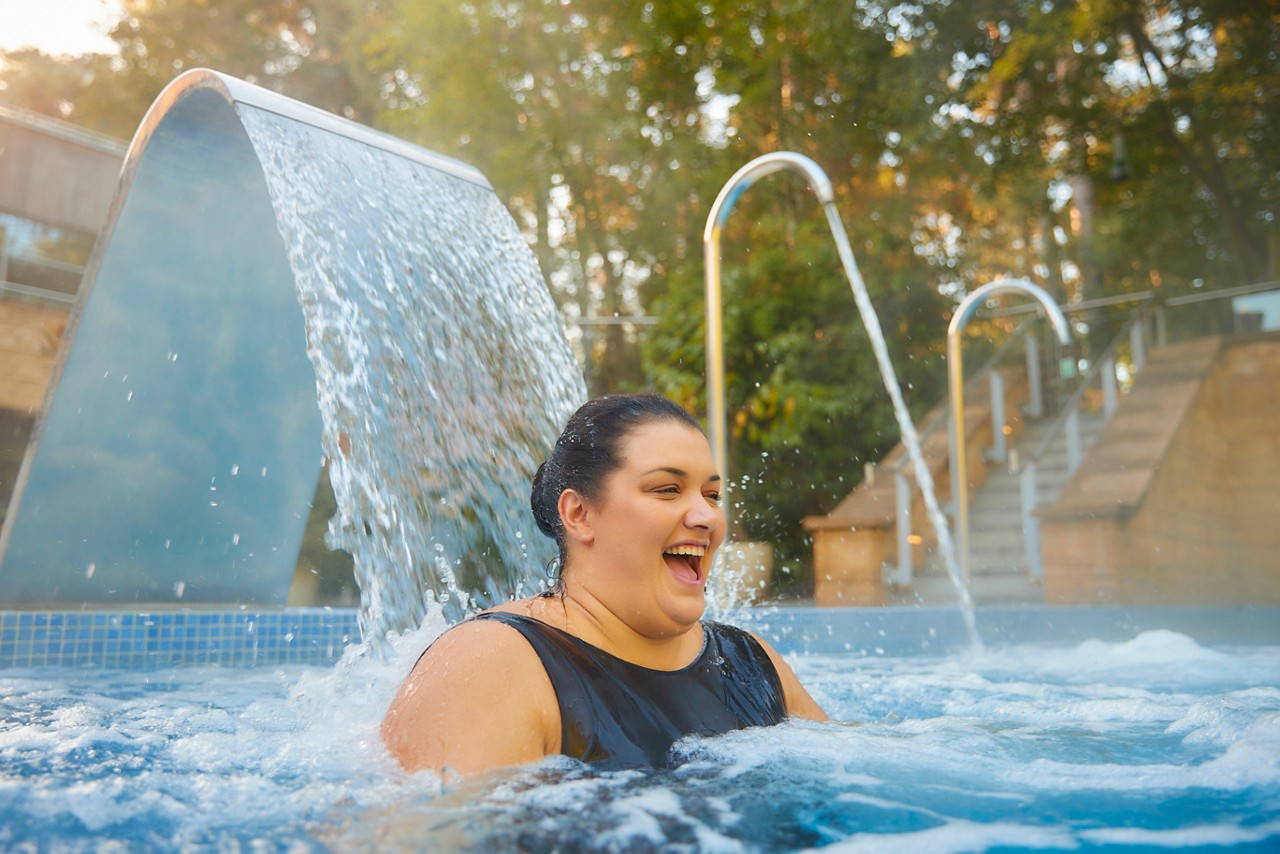 A women in a outdoor pool