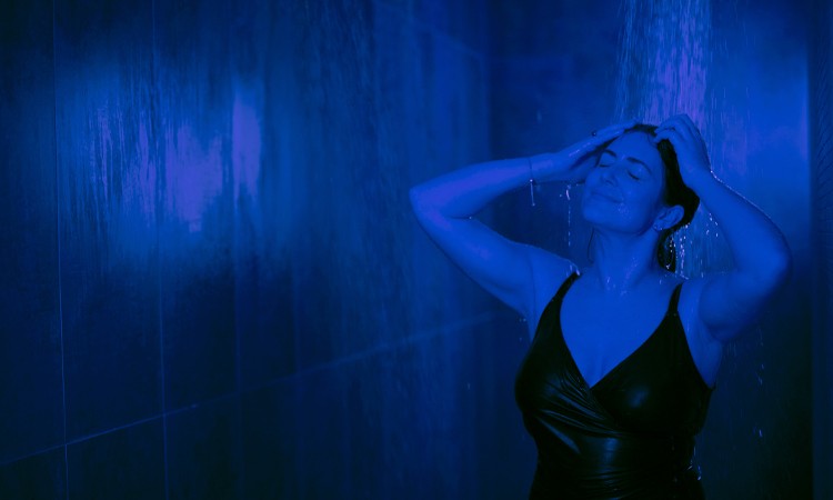 Woman soaking in the Thunder and Rain Shower.