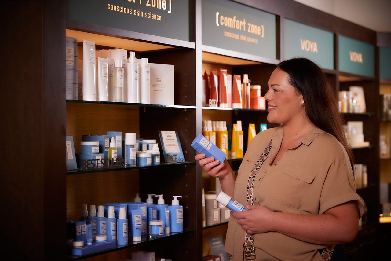 Woman looking at products in the Forest Spa Boutique.