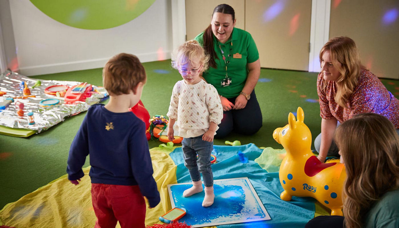 Children playing together in a bright colourful space.