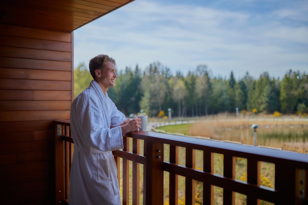man on the apartment balcony