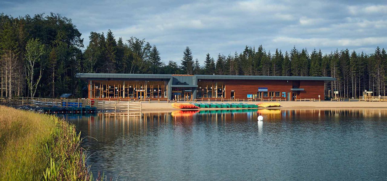 View of Longford Forest lake with Pancake House in the distance 