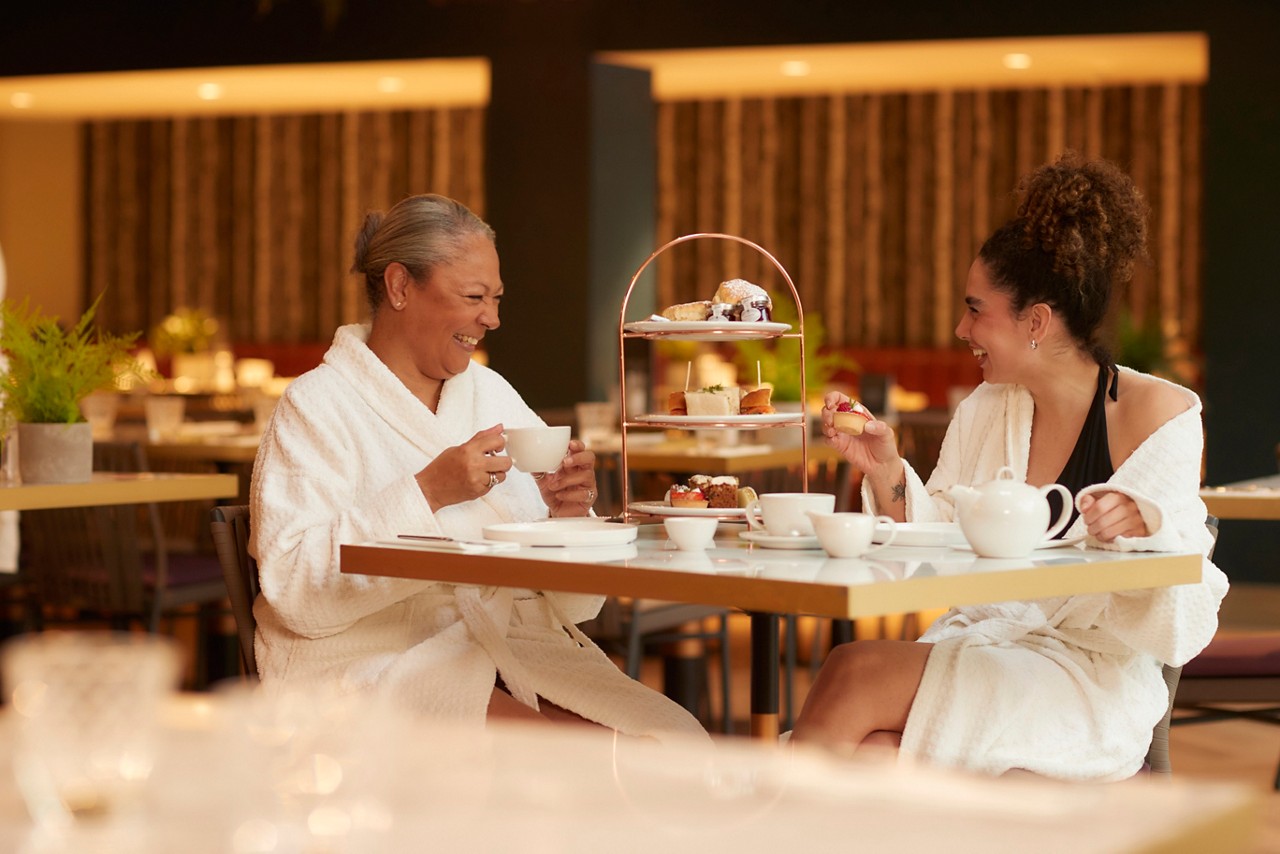 mother and daughter having afternoon tea