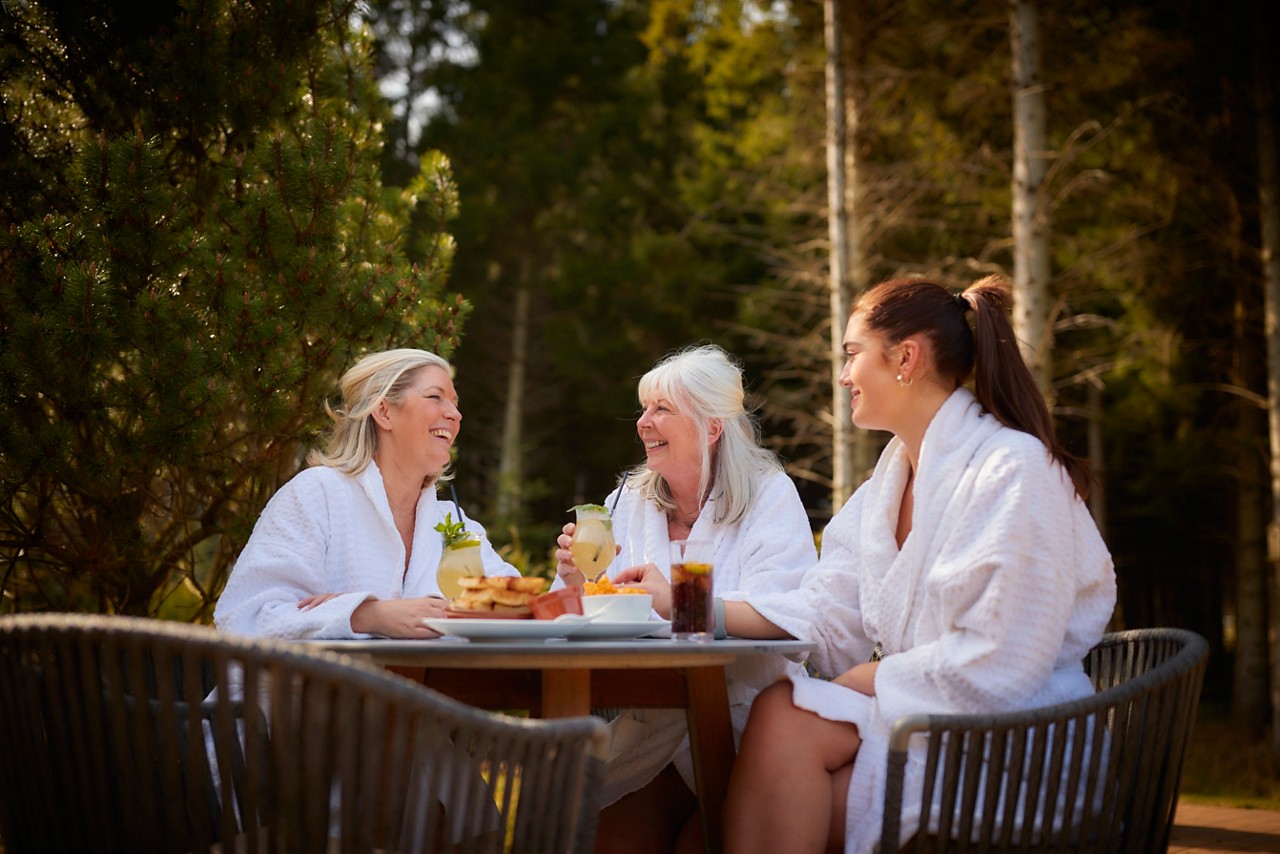 grandma, mum and daughter having lunch outside