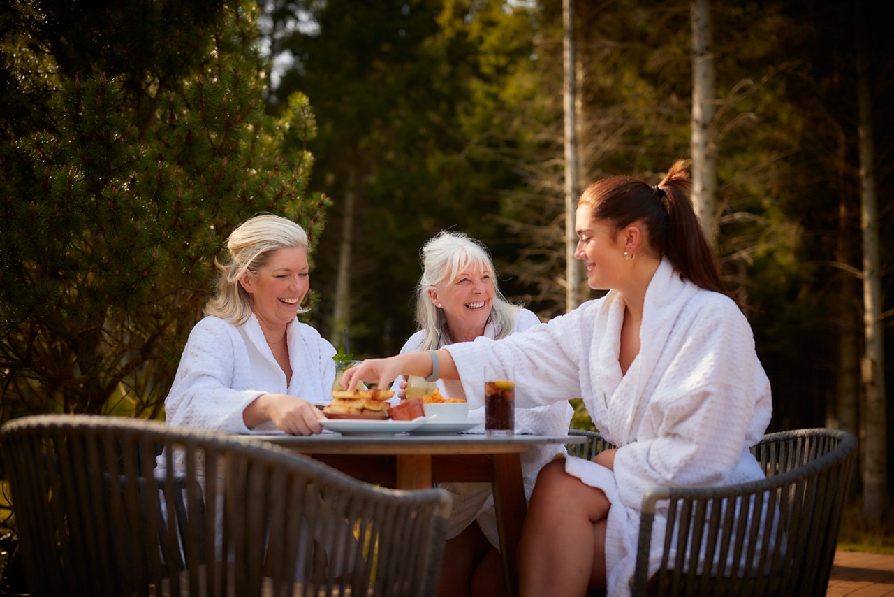 grandma, mum and daughter having lunch outside