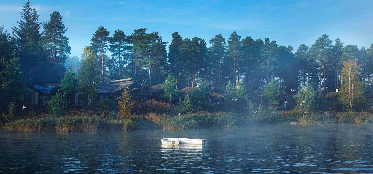 Boat floats on calm lake near forested shoreline with cabins; morning mist hangs over water; tall pines rise under clear blue sky and distant birds.